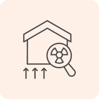 House with magnifying glass and radiation symbol.